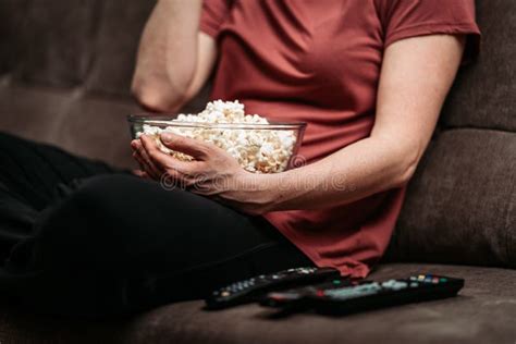 Ready for a movie night with popcorn and remote control on a comfortable sofa